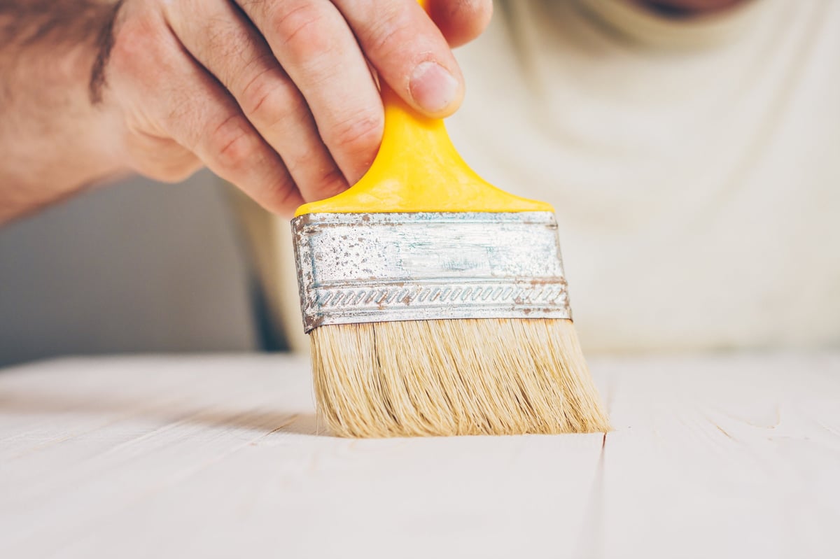 Finishing works - applying a primer or varnish on a wooden surface
